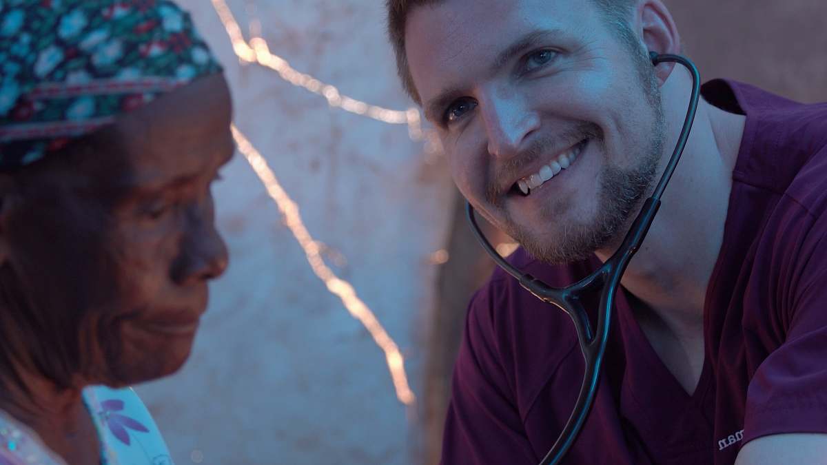 human man in maroon shirt haiti
