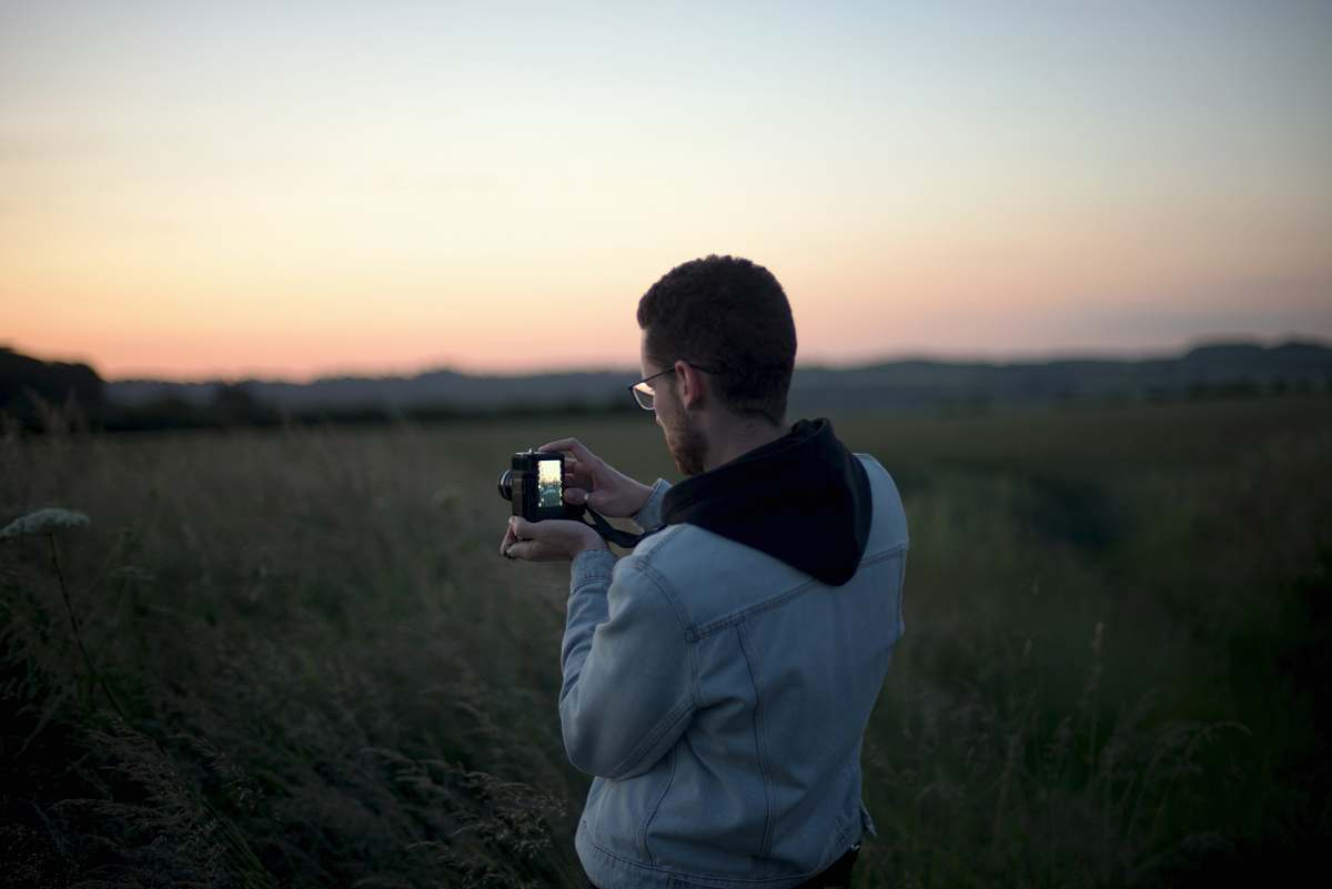 human man taking photo photo