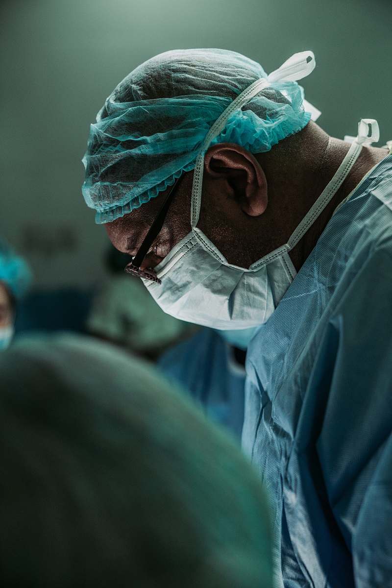 human man wearing medical mask and robe clinic