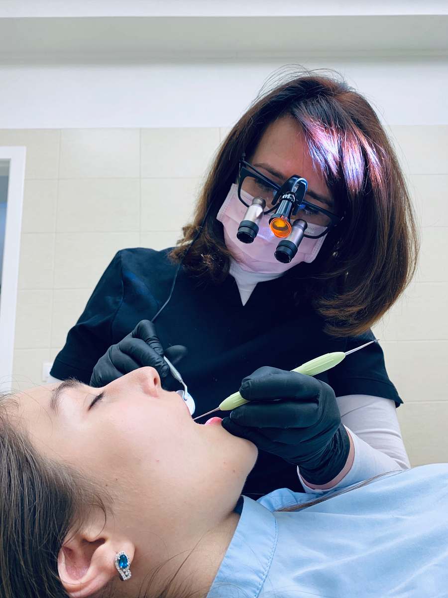 human woman holding medical tool on person's mouth accessories