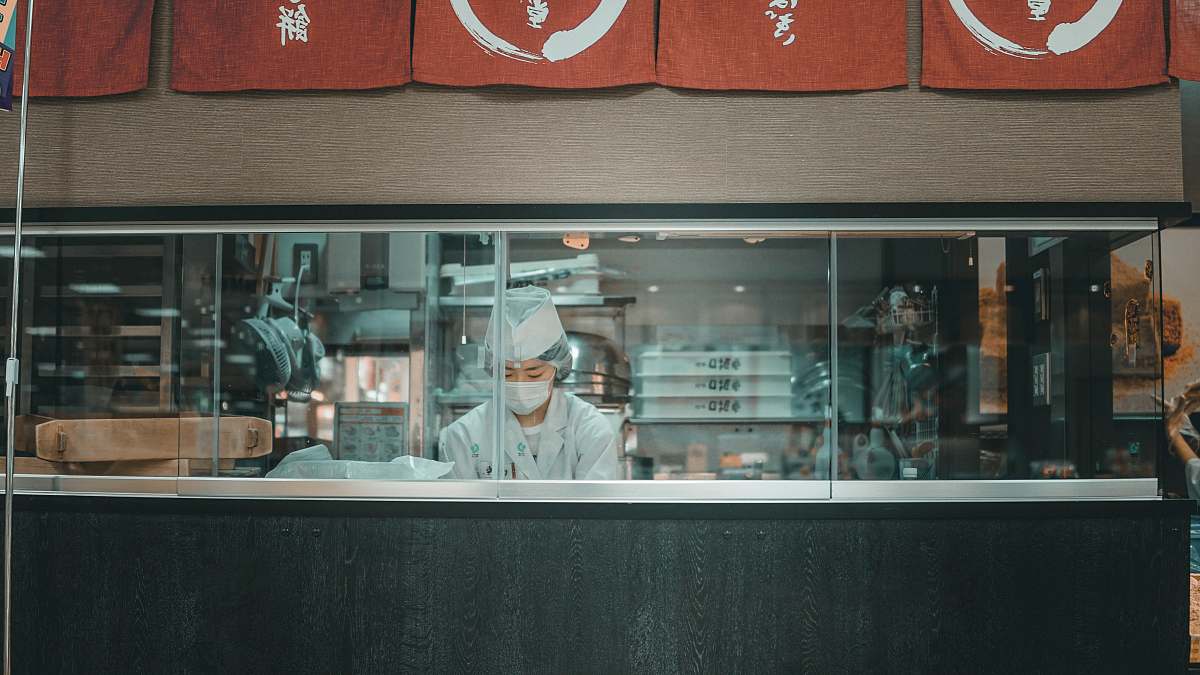 human woman standing inside store people