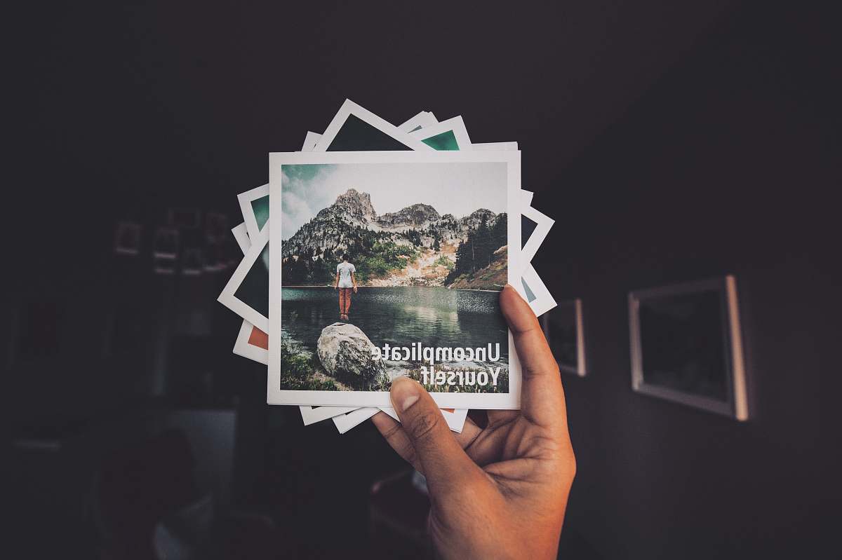 picture person holding photo lot photos