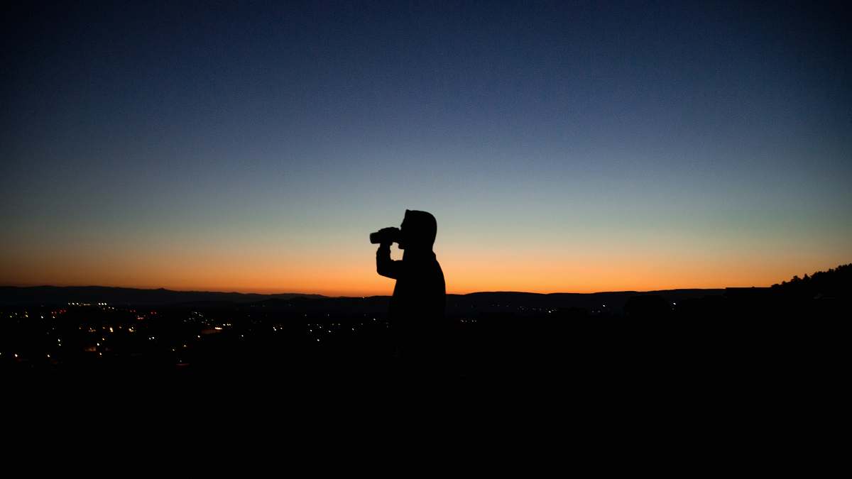 photo silhouette photo of man about to drink photographer