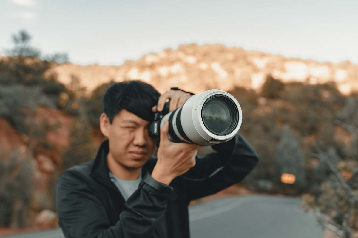 human white and black DSLR camera person