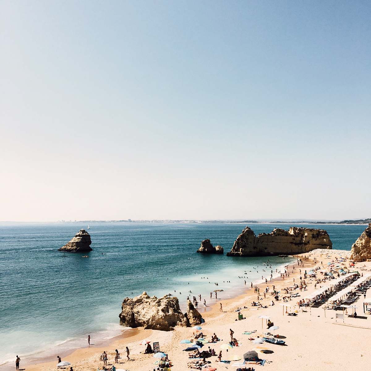 ocean people on seashore during daytime sea