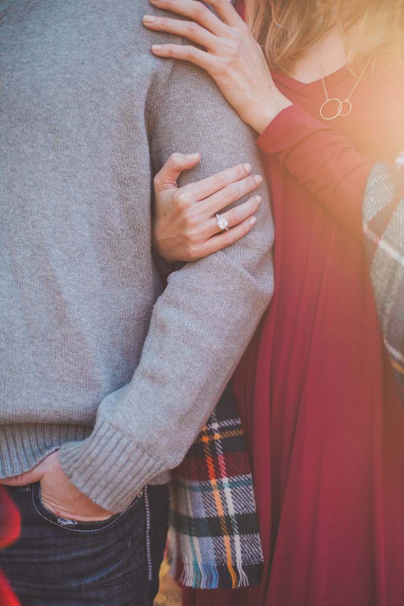engagement woman holding the shoulder of man engaged