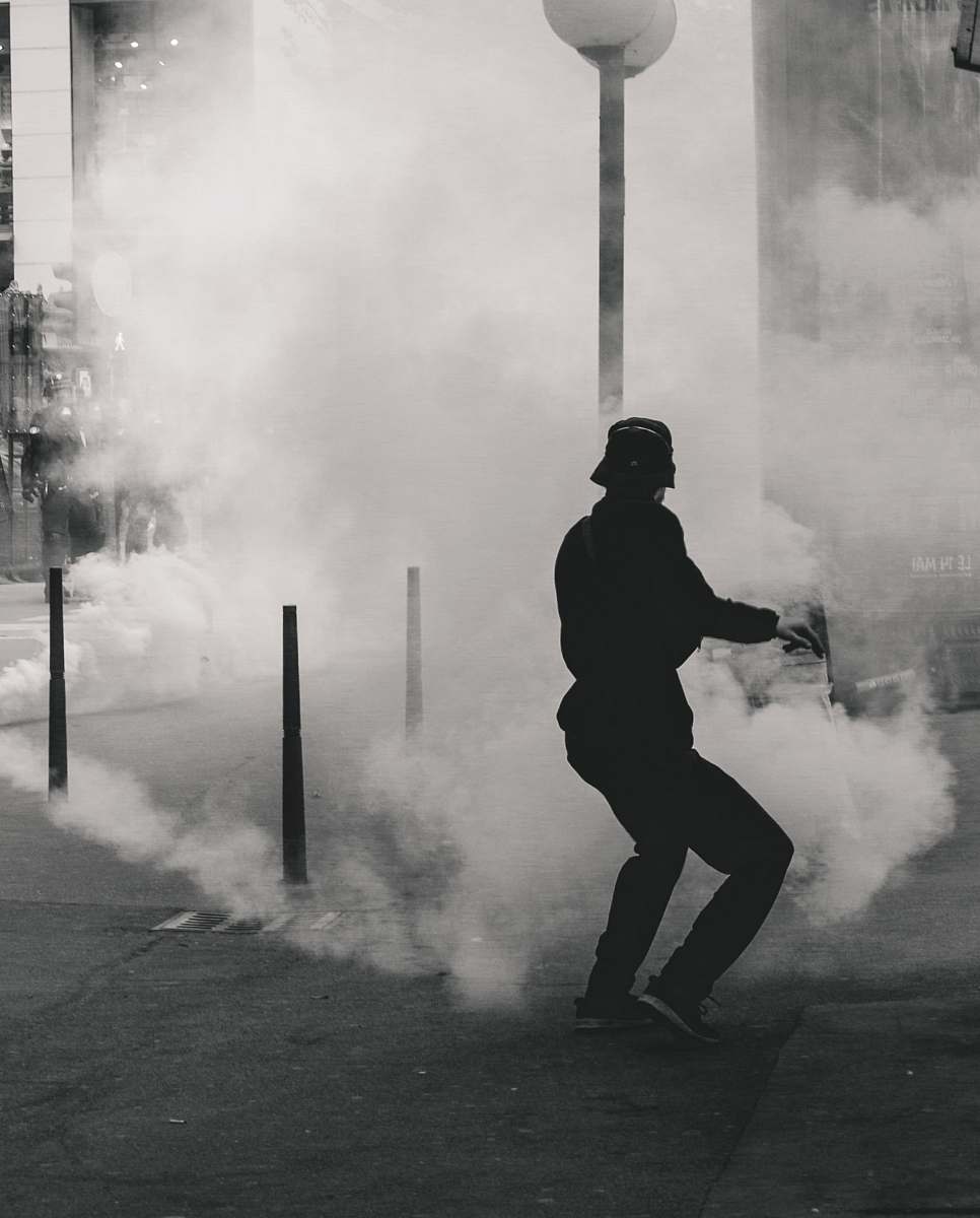 human man standing near smoke person