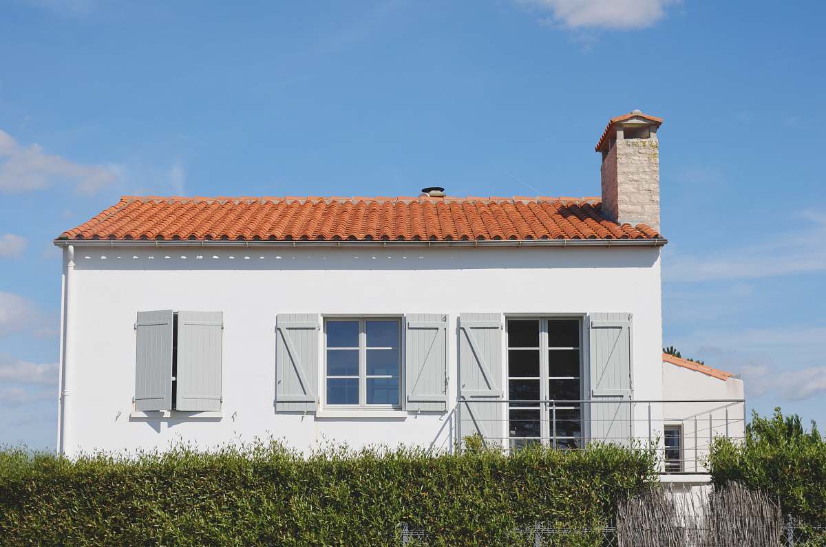 building white and orange painted house housing