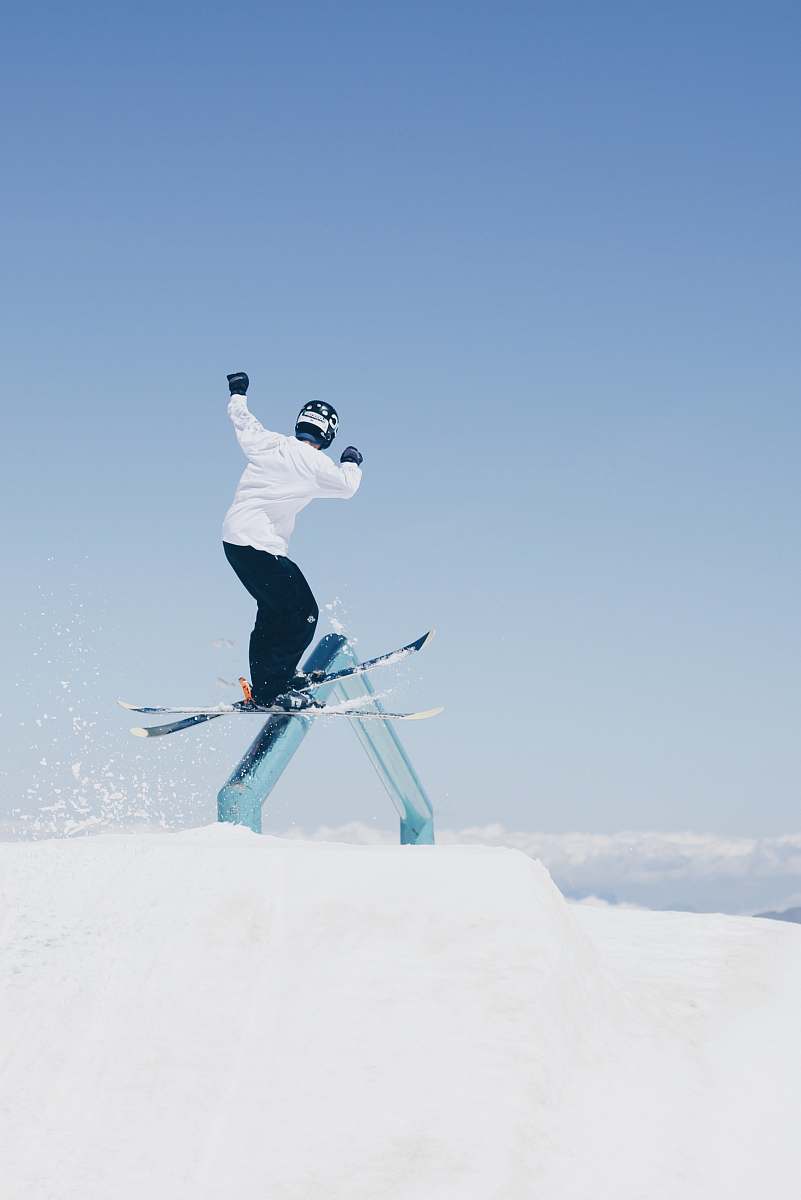 nature man doing tricks on skis person