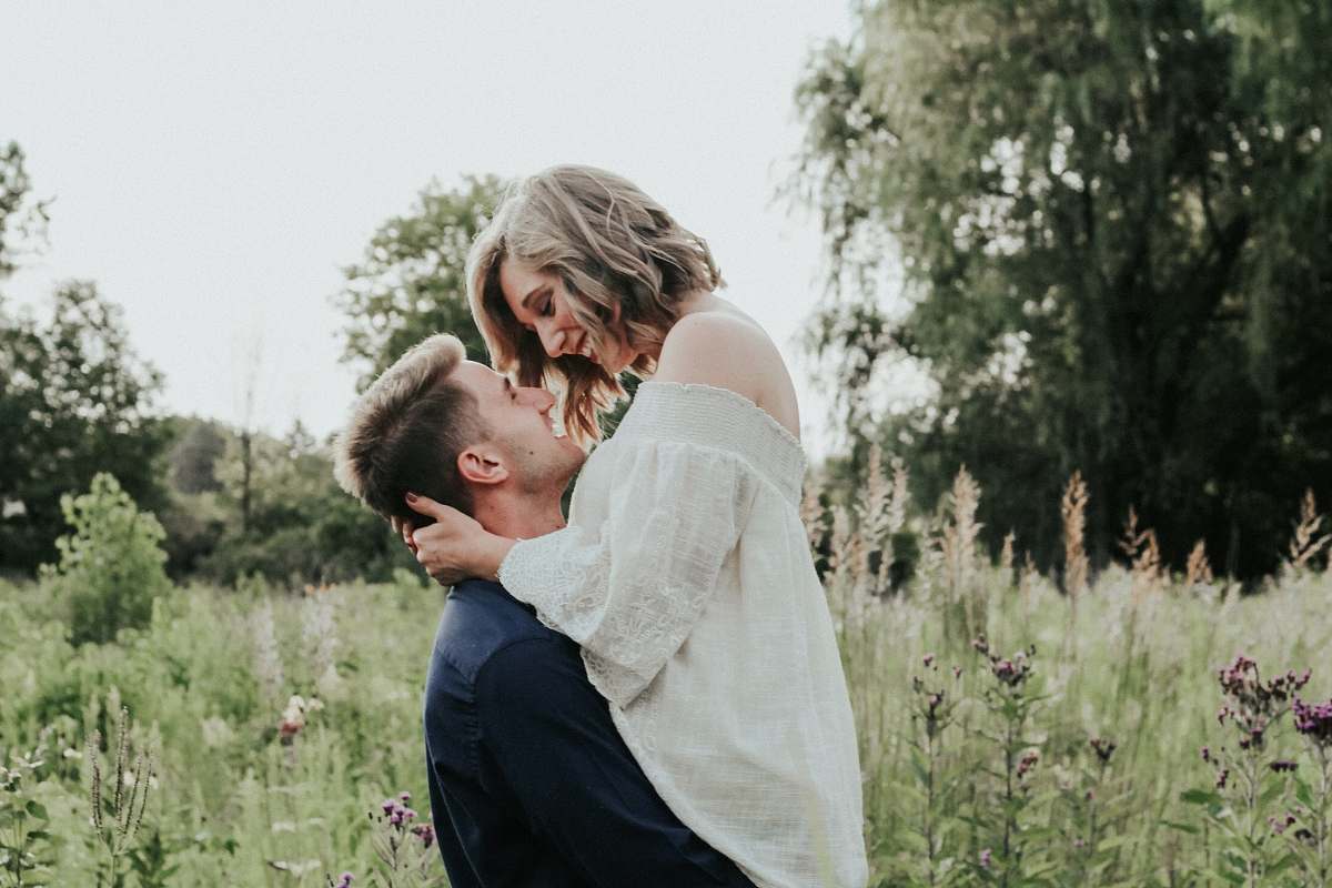 human couple near green tree during daytime person