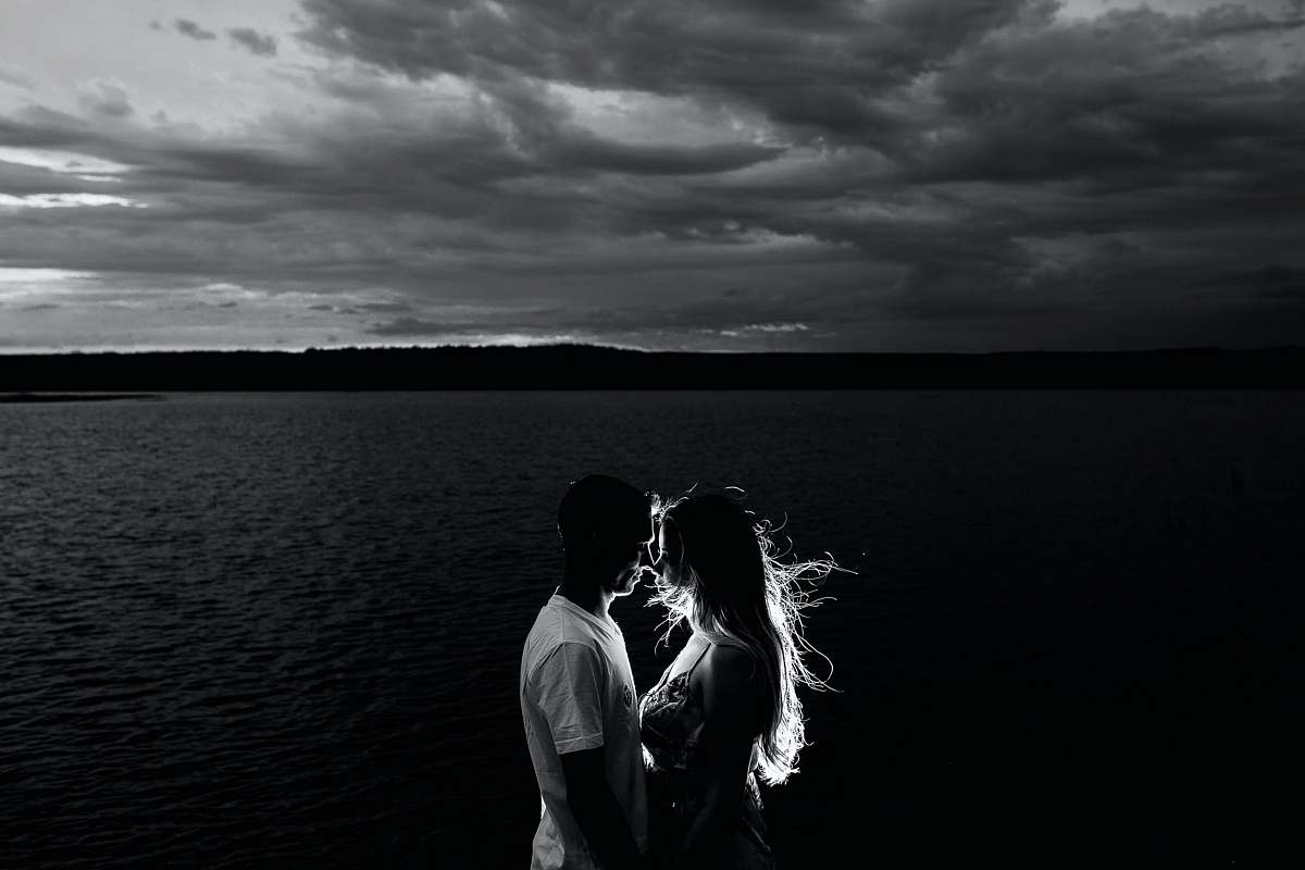 love grayscale photo of couples near body of water human