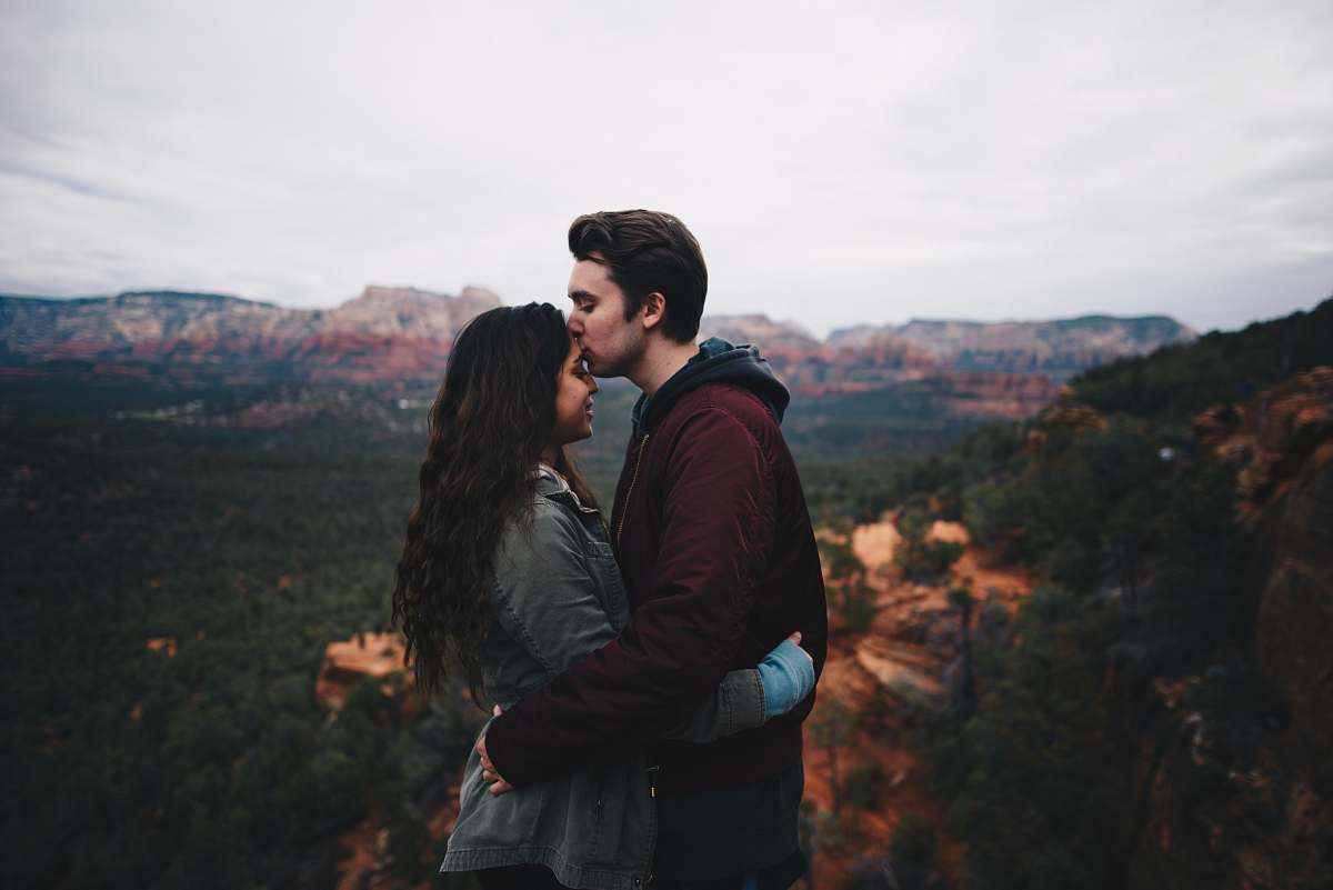 nature man kissing woman's forehead love