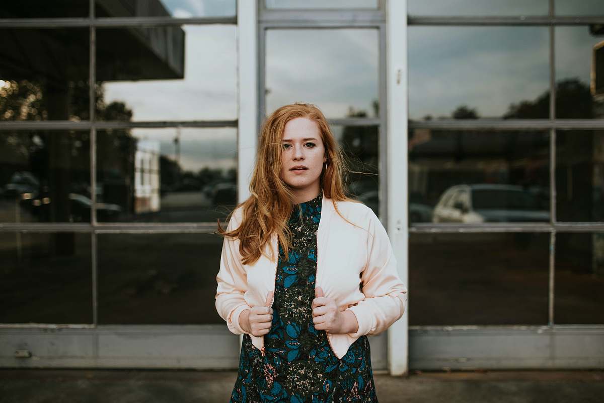 human woman holding her jacket person