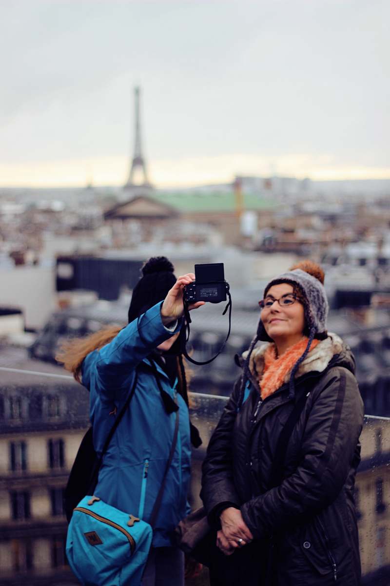 clothing two women taking selfie coat