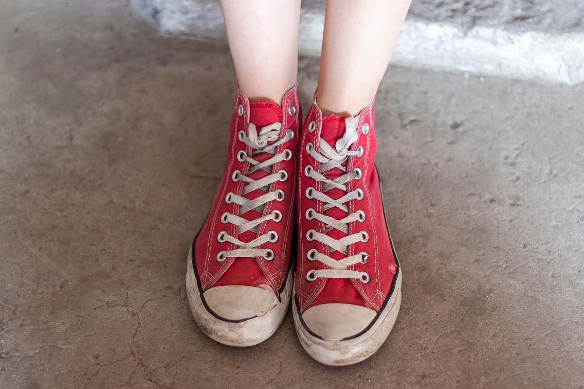 red person wearing red high-top sneakers shoes