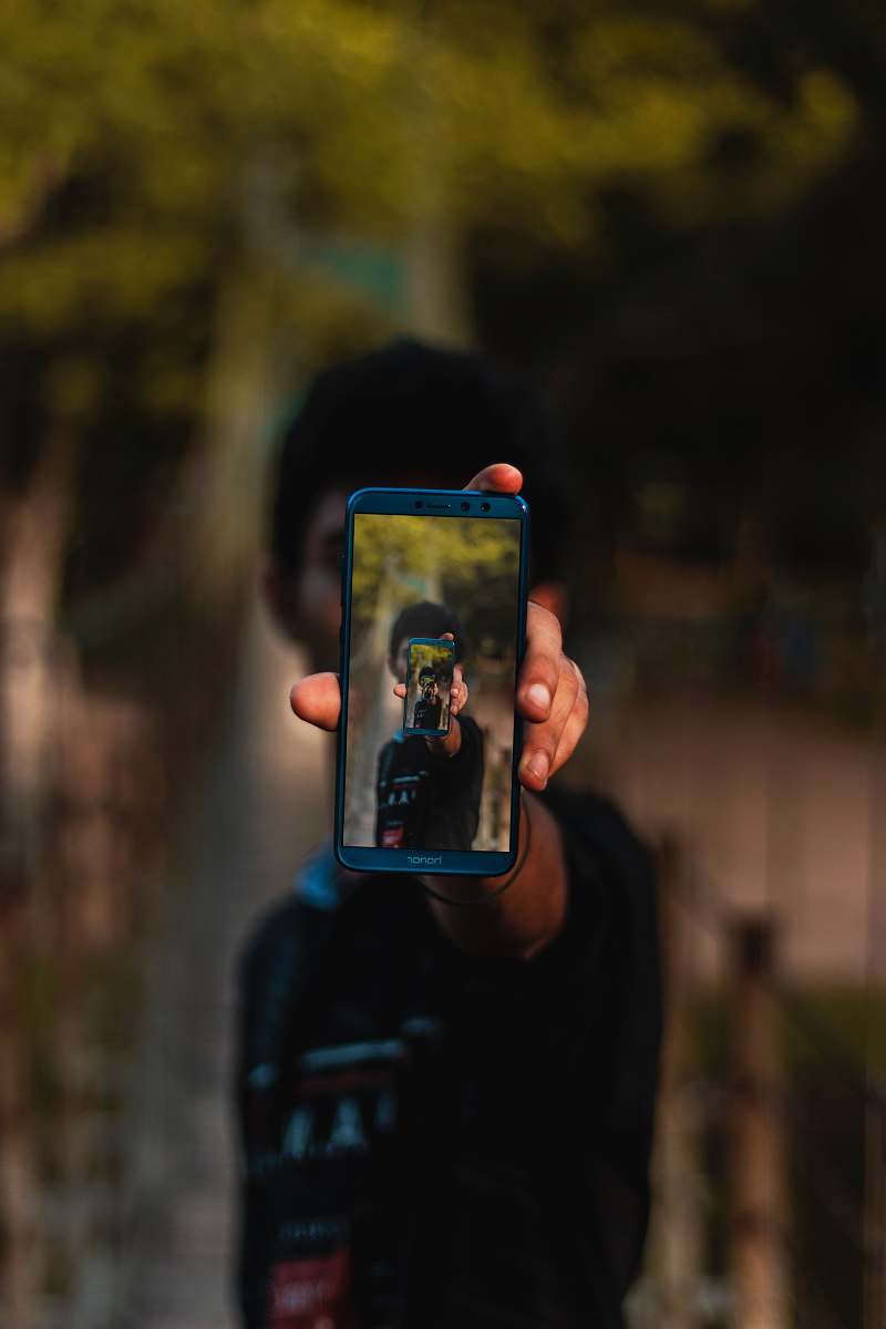 phone man using phone while standing cell phone