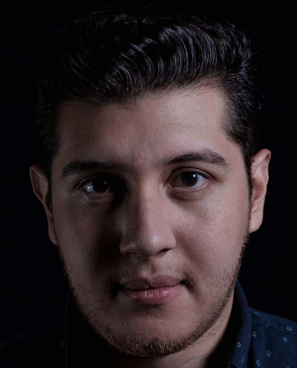 person man in black and white polka-dot collared shirt human