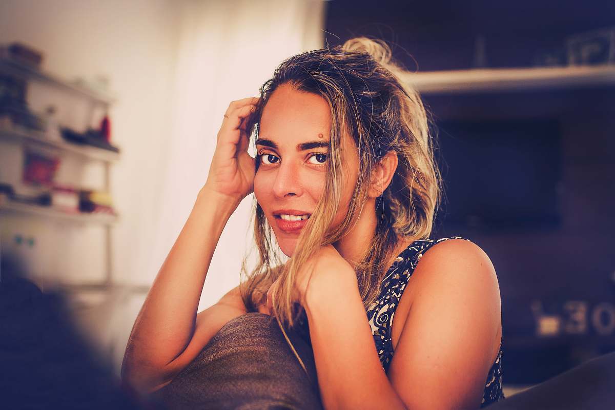 person smiling woman in black and white tank top human