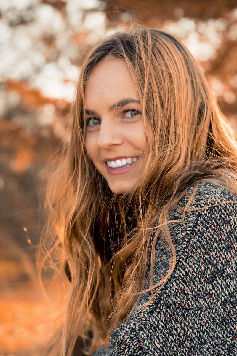 woman smiling woman wearing gray dress girl