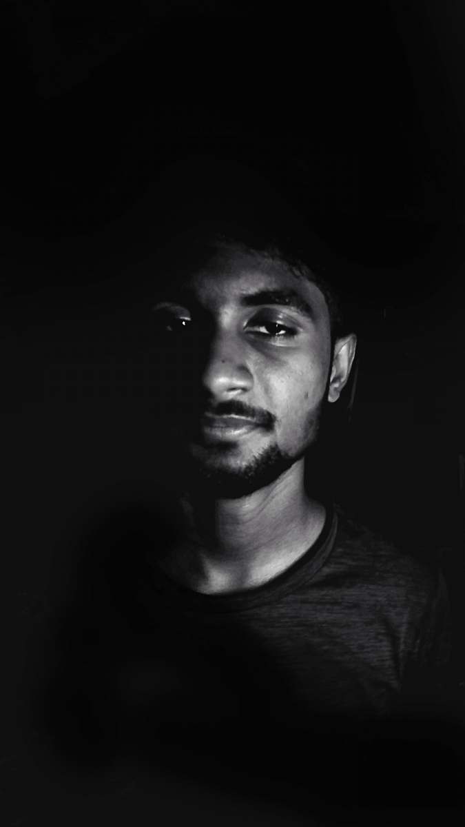 black-and-white grayscale photo of crew-neck top face