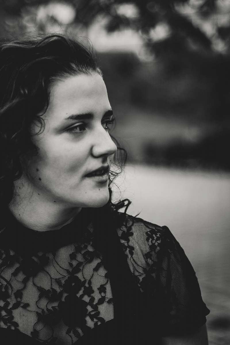 black-and-white grayscale photography of woman wearing lace short-sleeved top face