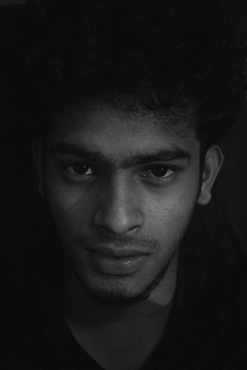 black-and-white man in black top face