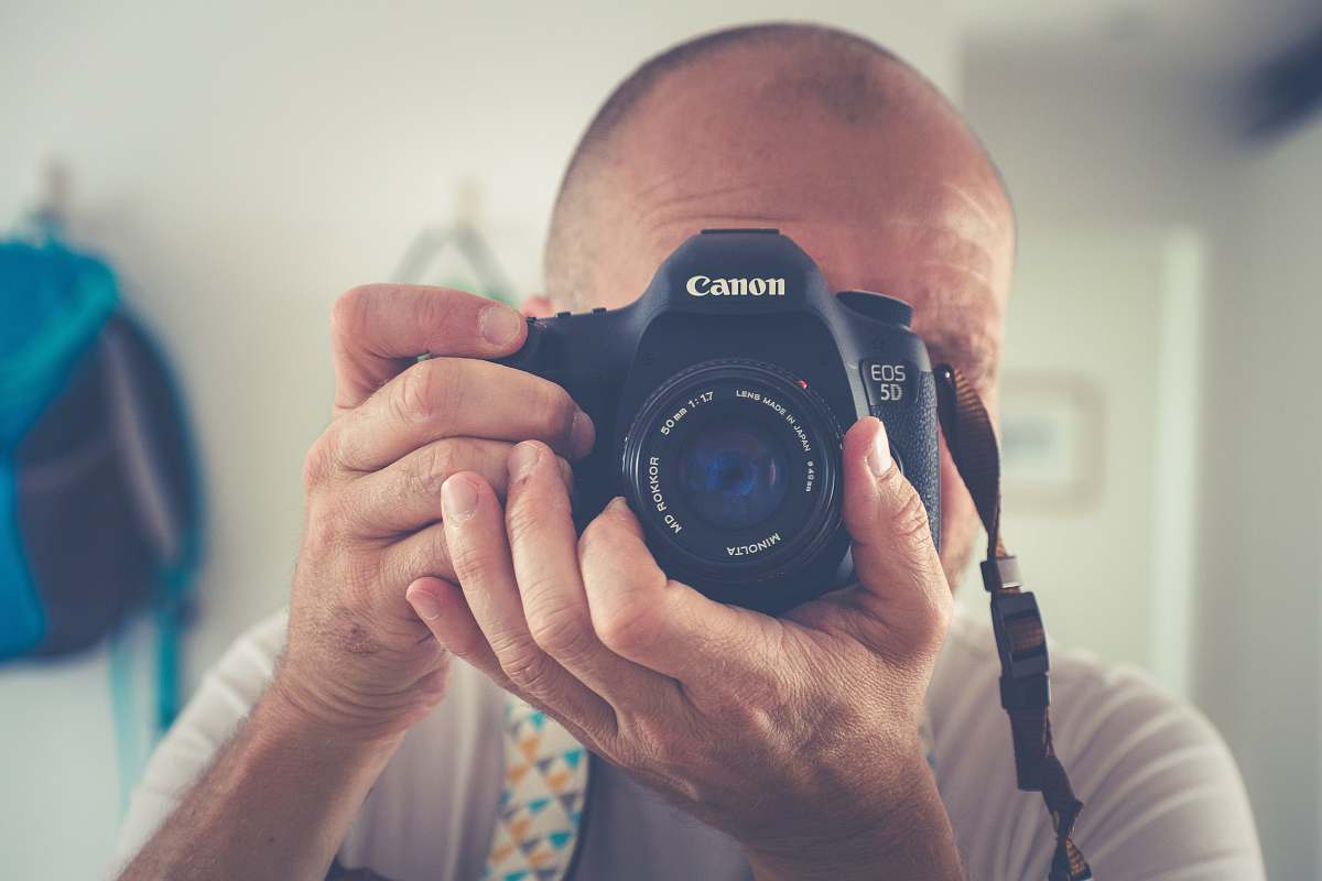 person man taking photo camera