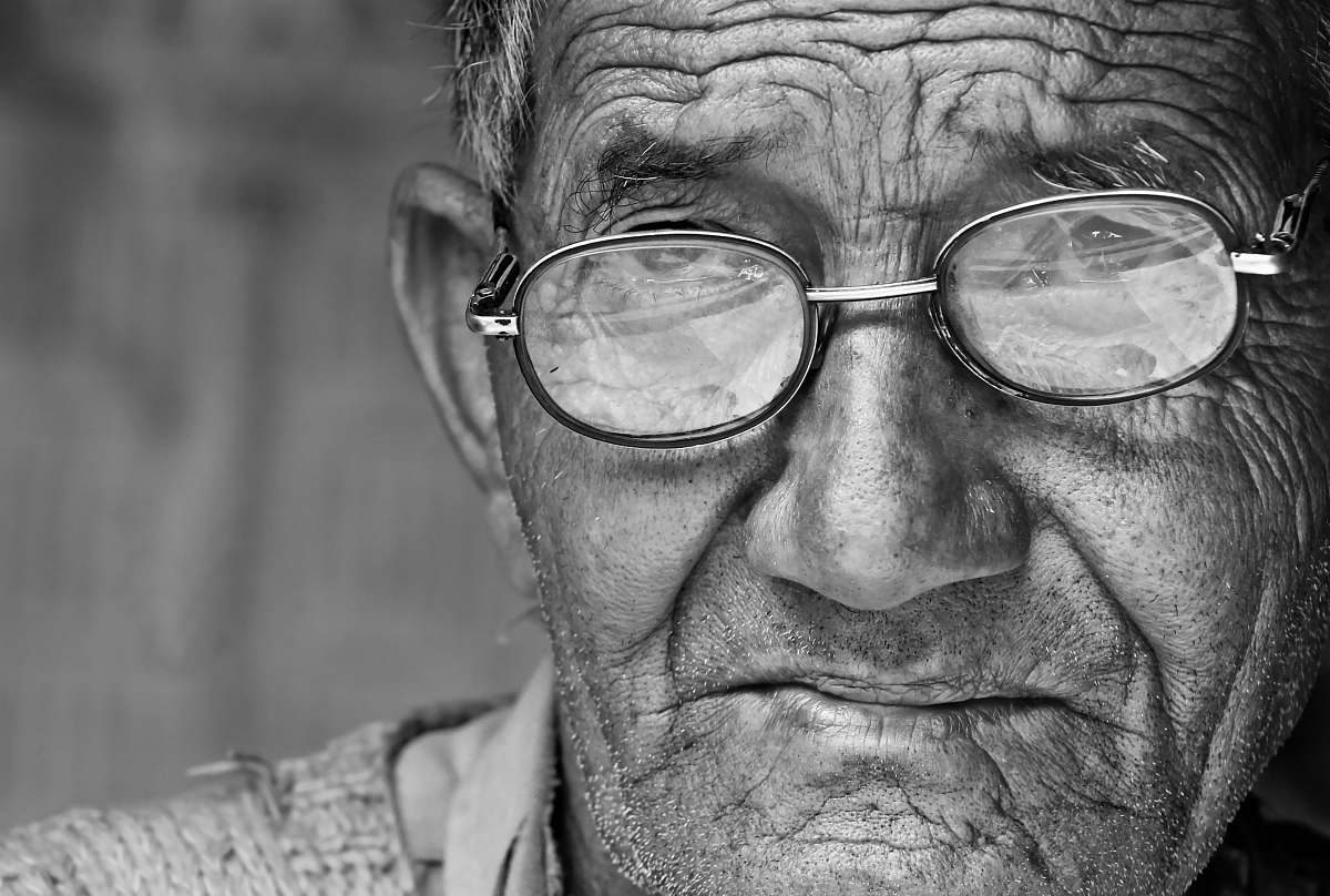 black-and-white man wearing eyeglasses face