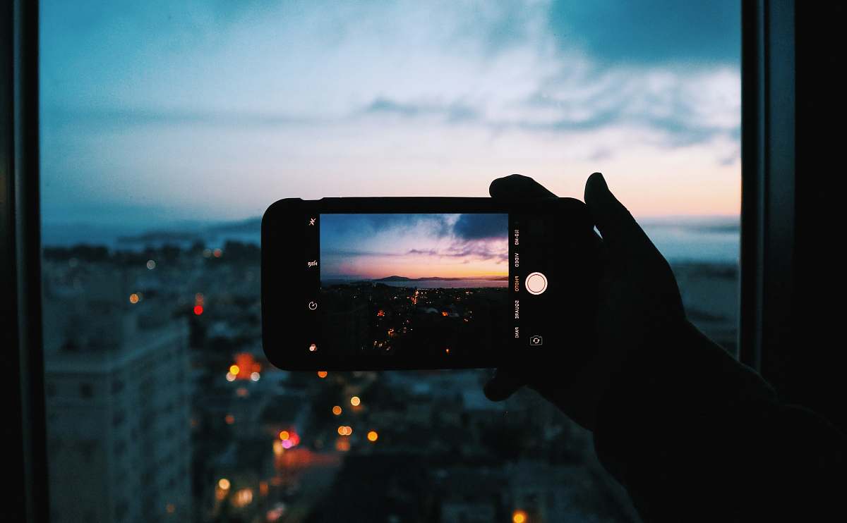 person person taking photo of buildings san francisco