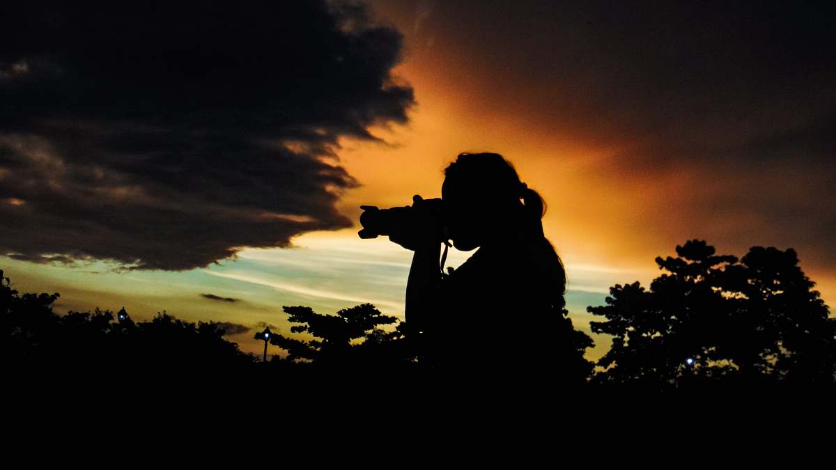 person person taking photo of nature photographer