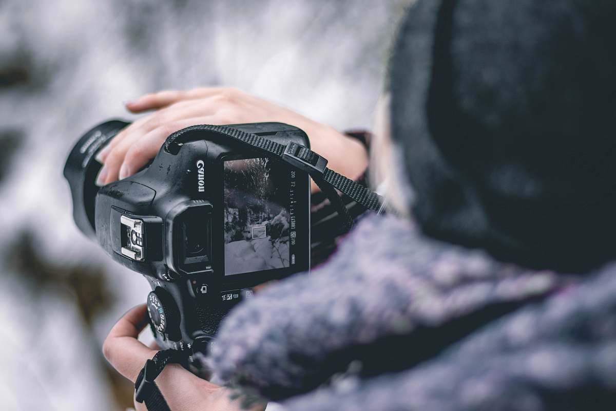 person selective focus photography of DSLR camera photography