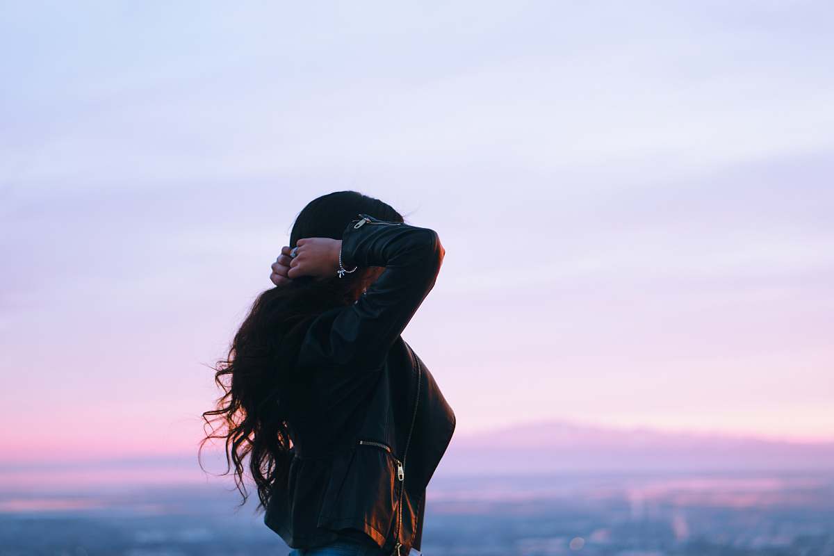 person woman holding her hair apparel