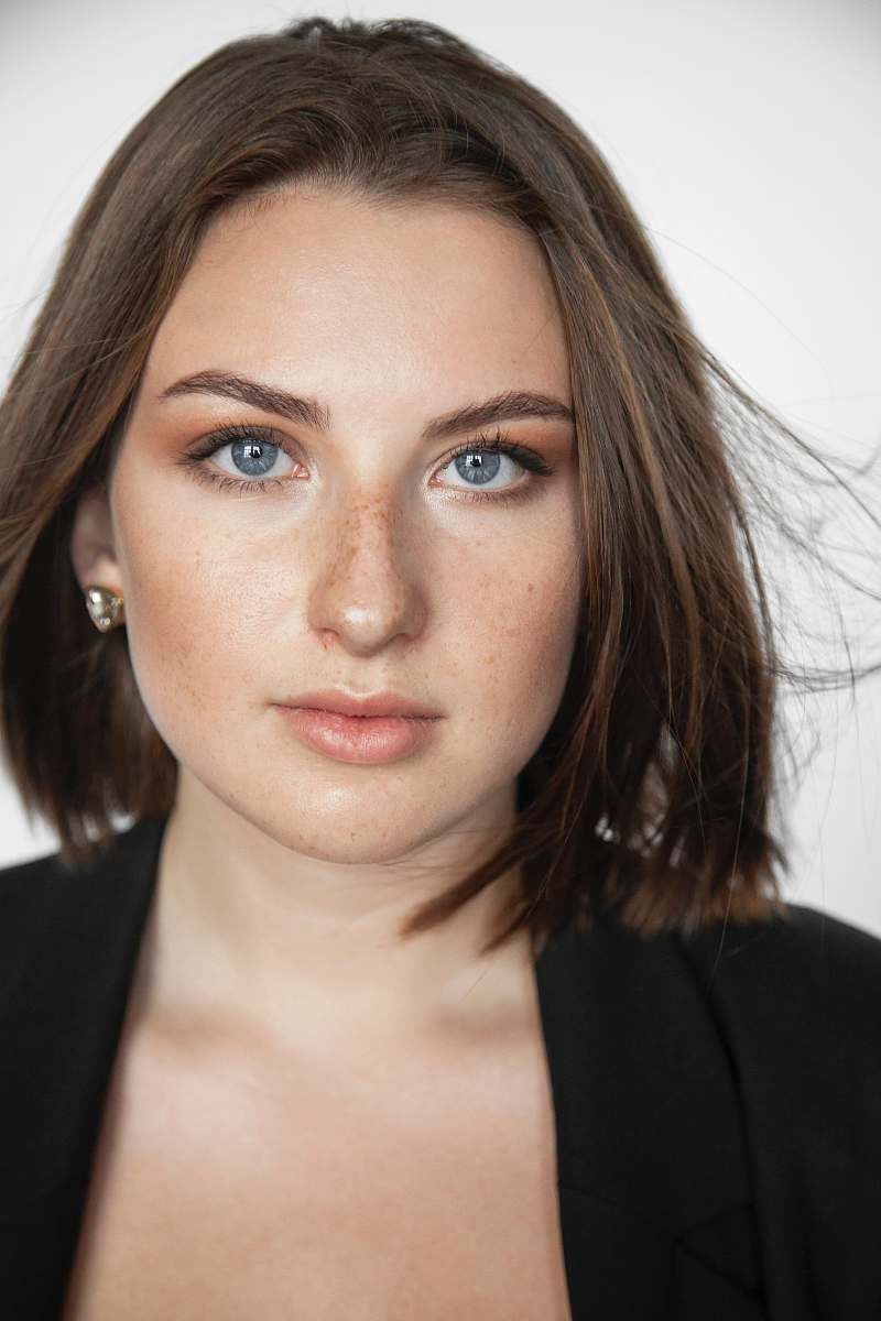 person woman wearing black coat face