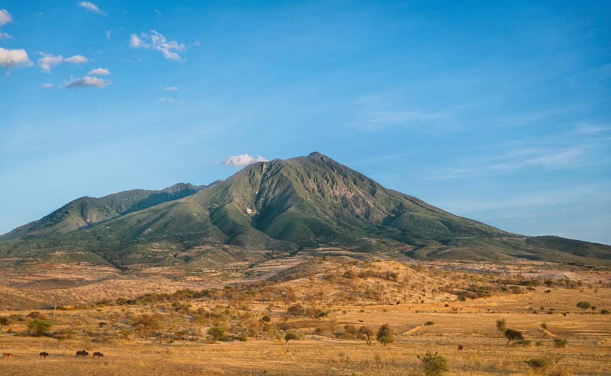 nature photo of mountain with brown soil in vicinity desert