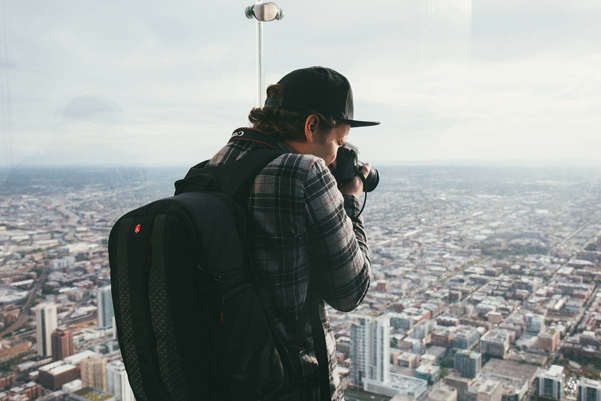 landscape man taking photo of buildings nature