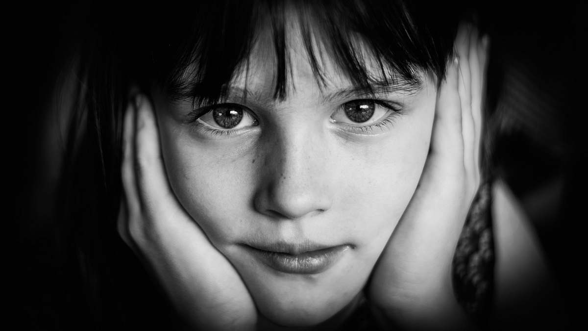 black-and-white girl's face in grayscale photo face