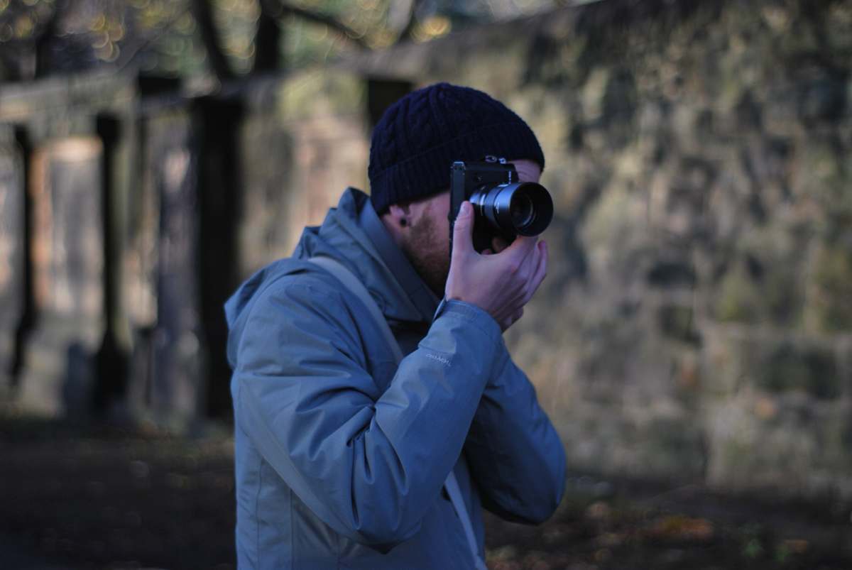 human man using camera photographer