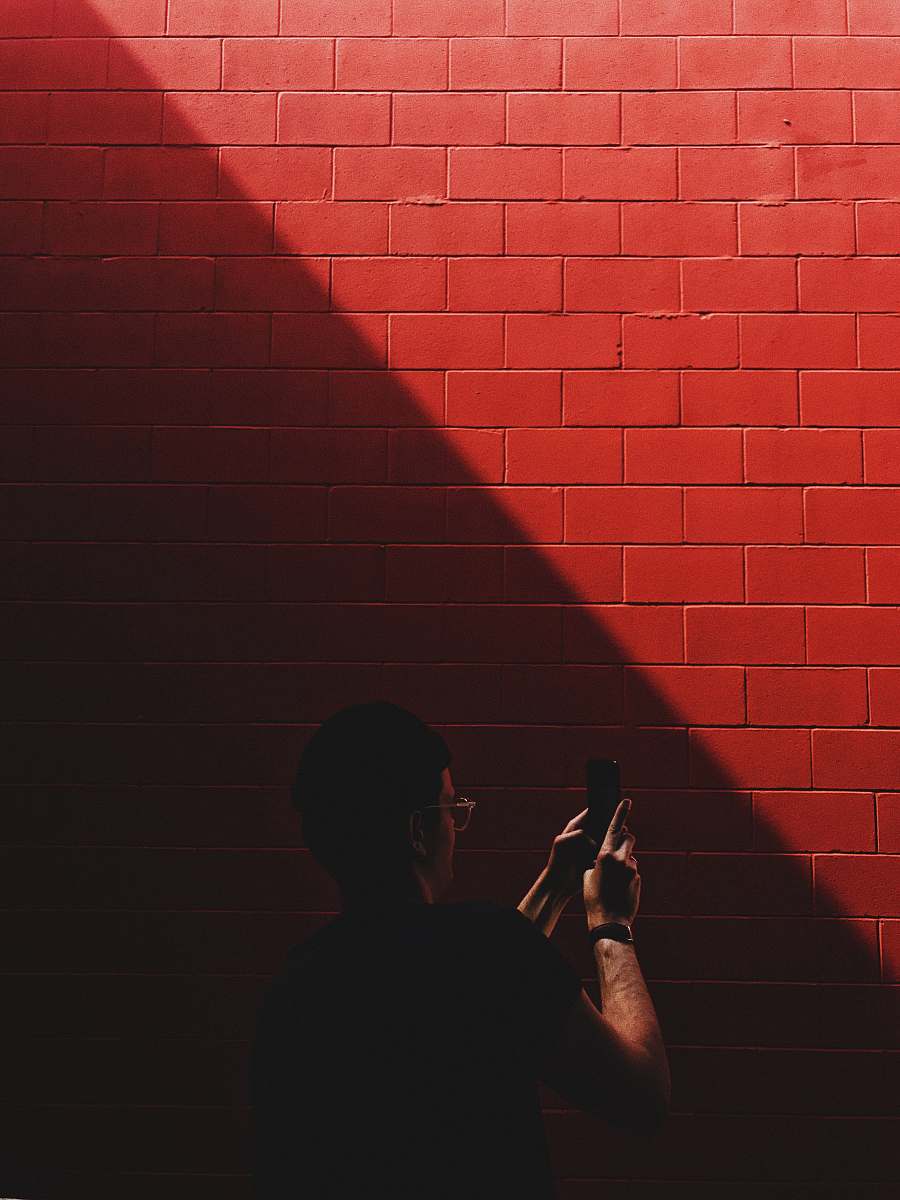 human person capturing red brick red