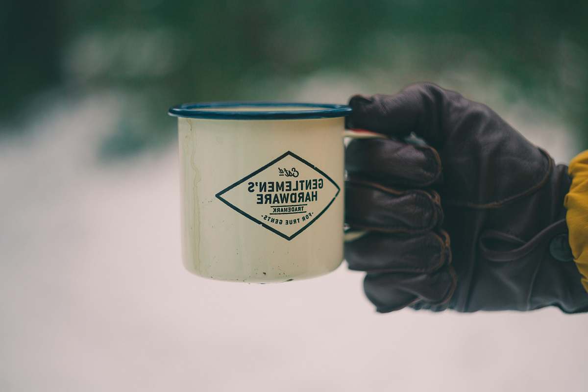 human person holding white ceramic mug people