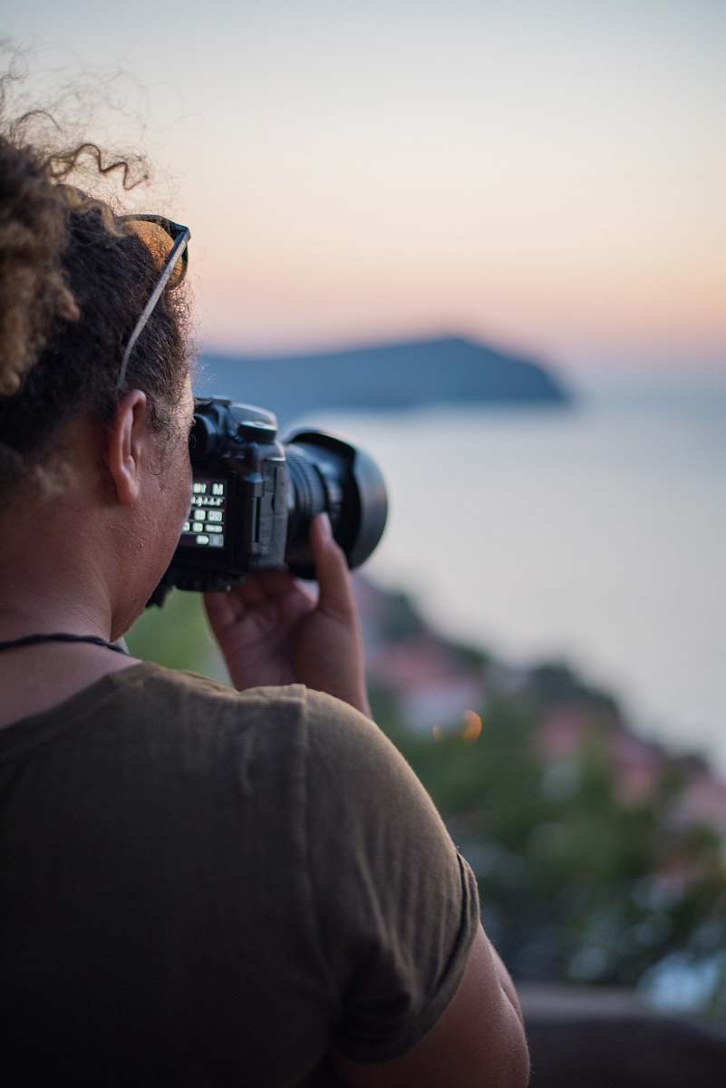 human woman holding camera camera