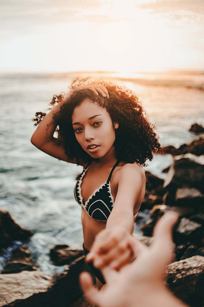 apparel woman holding person's hand clothing
