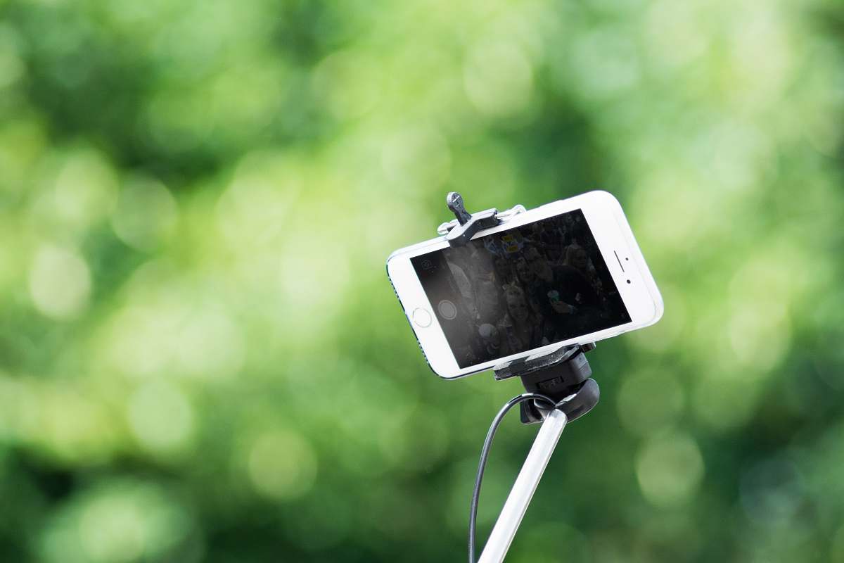white shallow focus photography of iPhone smartphone green