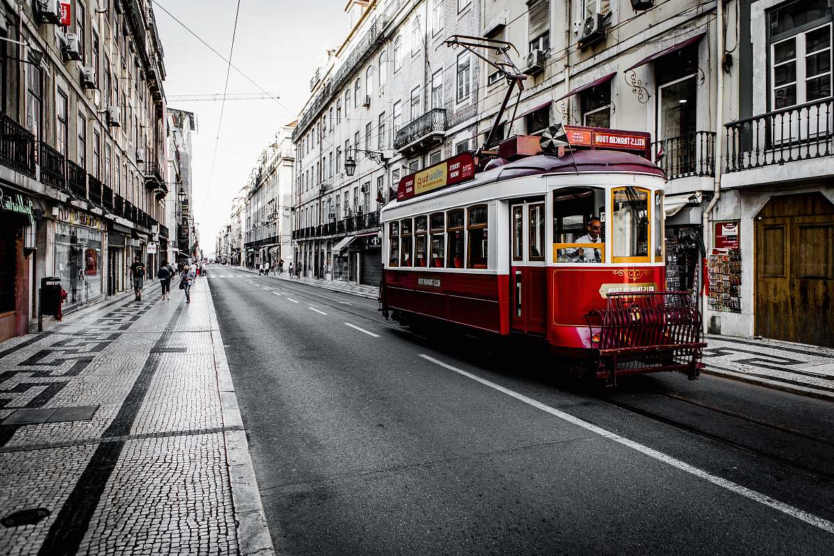 tram white and red vehicle on road streetcar