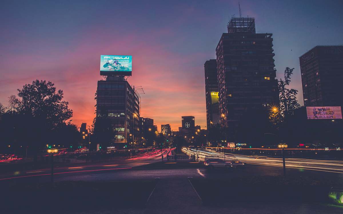 building city buildings during sunset cars