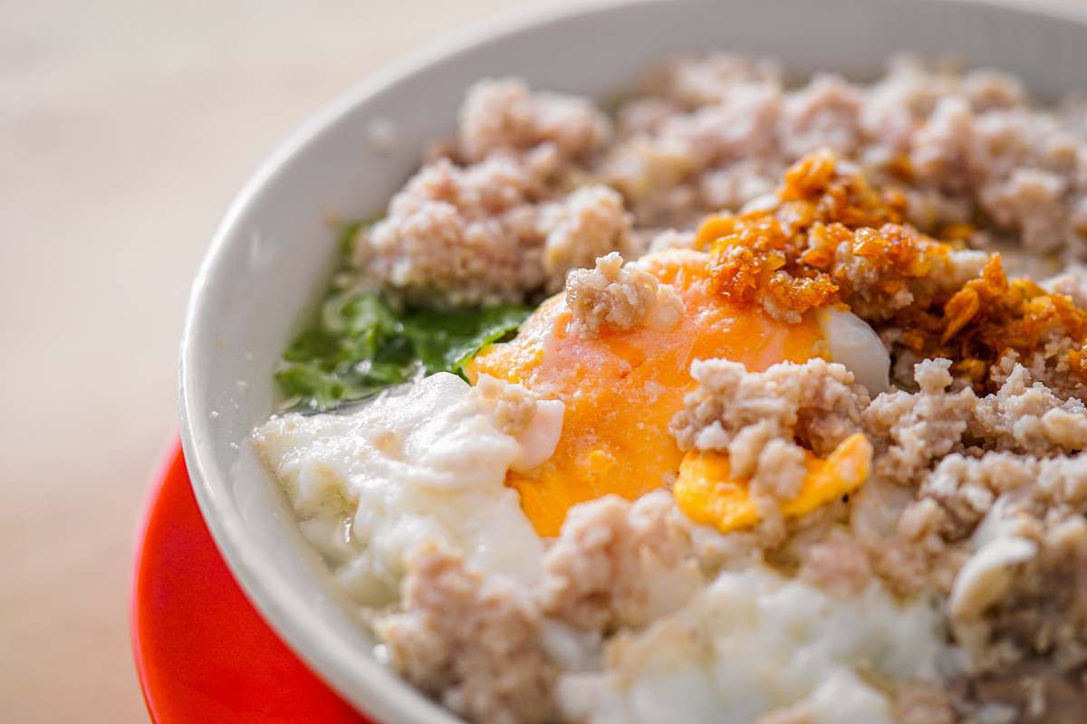 breakfast bowl of food on red surface oatmeal