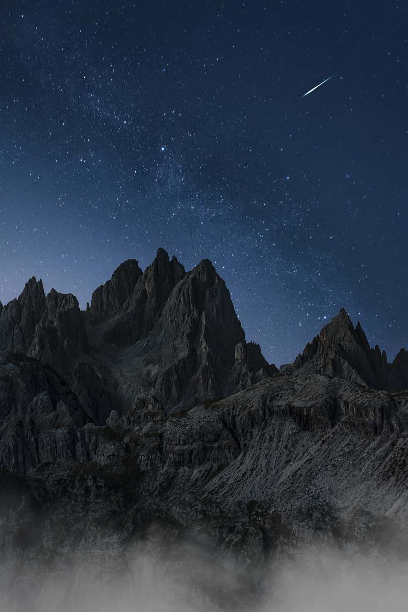 outdoors black and white mountain under blue sky night