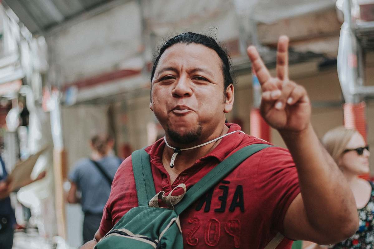 human man making peace hand sign people