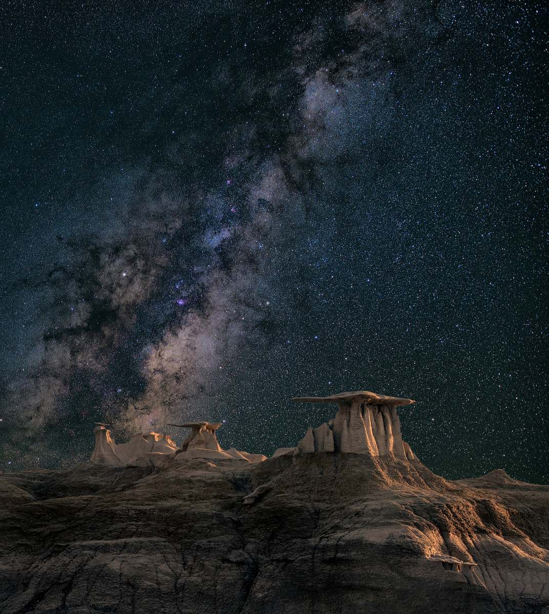 night brown mountain under starry sky galaxy