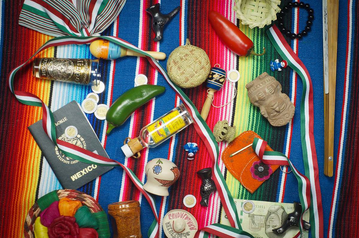 flatlay flat lay photography of vial, medal, and book on striped cloth flatlay lifestyle