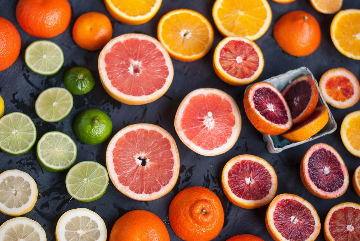 fruit sliced orange fruits on black surface citrus fruit